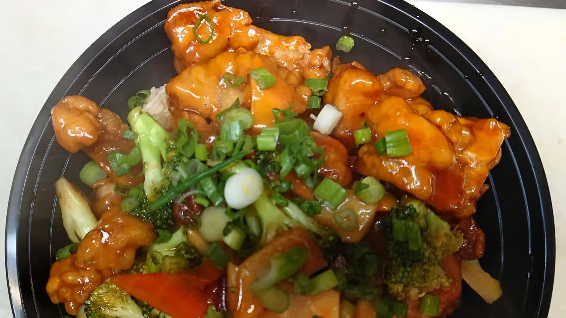 General Tso Chicken Bowl - Crispy chicken with veggies over rice at Senryyo, a Asian Fusion Restaurant in Lawrence